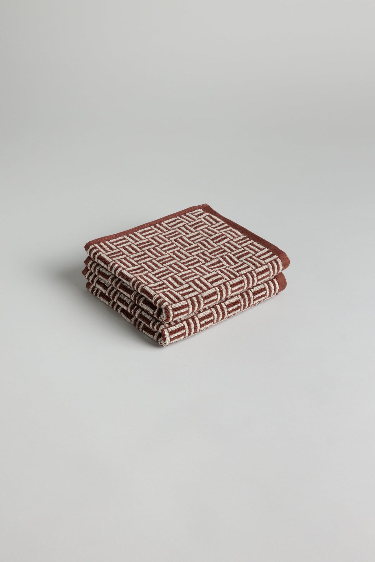 Two BAINA Torrens Hand Towels in Mudbrick & Crème